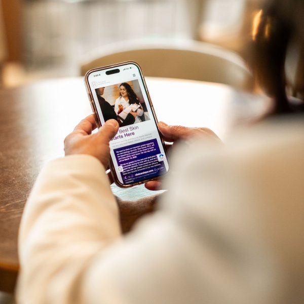 looking at revive clinic website on phone